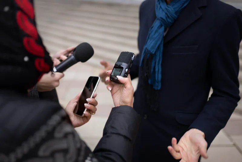 close-up-reporter-taking-interview (1)