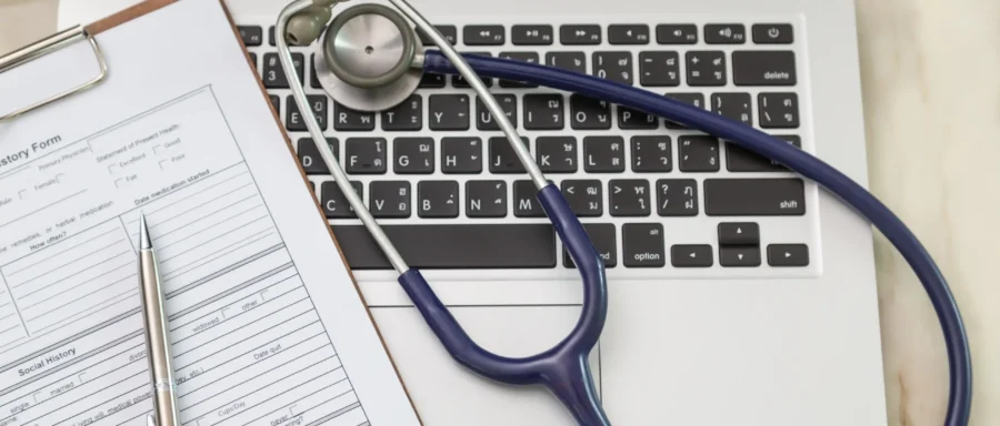 top-view-laptop-with-stethoscope top-view-laptop-with-stethoscope